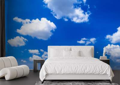 Bright blue sky background with clouds Wall mural