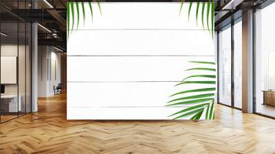 Green leaves of palm tree on white wood table background, Tropical green palm leaves, Top view, Flat lay. Wall mural