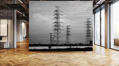 high voltage post,High voltage tower sky sunset background.Electric tower, silhouette at sunrise. Wall mural