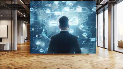 Business professional analyzing a global business network on a digital interface, with data exchange visuals and cloud computing elements Wall mural