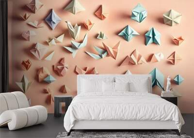 A collection of delicate, pastel-colored origami figures on a soft, pastel peach background with a subtle gradient effect Wall mural