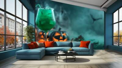 A green cocktail in a spooky Halloween setting surrounded by carved pumpkins and misty atmosphere, creating an eerie and festive ambiance for the celebration. Wall mural