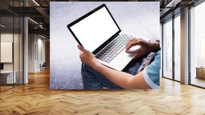 Man using laptop with white blank screen can be add your texts or others, empty copy space for advertising, product display. Wall mural