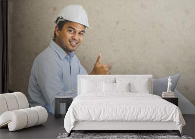 Asian civil engineer working planning project with laptop. Wall mural