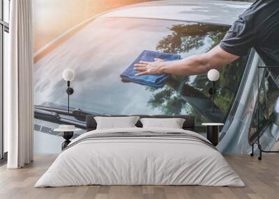 man cleaning car with microfiber cloth Wall mural