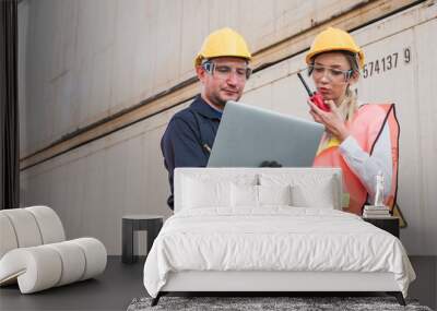 Two foreman man & woman worker working checking at Container cargo harbor holding laptop computer and using  to loading containers. Dock staff business Logistics import export shipping concept. Wall mural