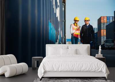 Two foreman man & woman worker working checking at Container cargo harbor to loading containers. Dock male and female staff business Logistics import export shipping concept. Wall mural