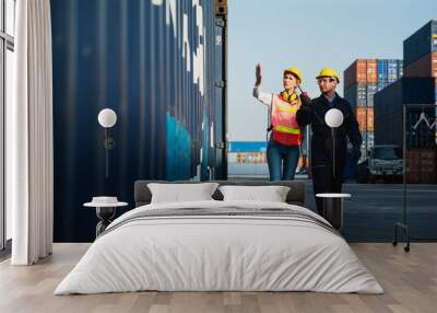 Two foreman man & woman worker working checking at Container cargo harbor to loading containers. Dock male and female staff business Logistics import export shipping concept. Wall mural