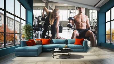 Young sporty Couple at fitness gym center Wall mural