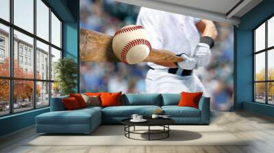 Baseball player hitting ball with bat in close up Wall mural