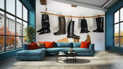 View on leather boots hanged Wall mural