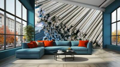 A bundle of stainless steel bars. Large industrial warehouse metal Wall mural