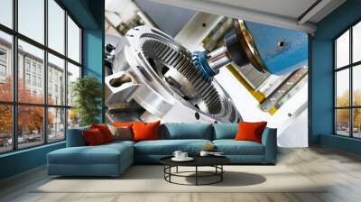 A modern CNC milling machine makes a large gear wheel. Wall mural