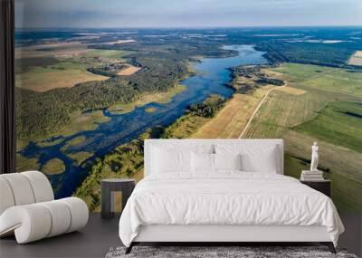 Beautiful aerial shot of a large forest lake. Wall mural