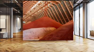 High pile of red color potassium fertilizers in storehouse Wall mural