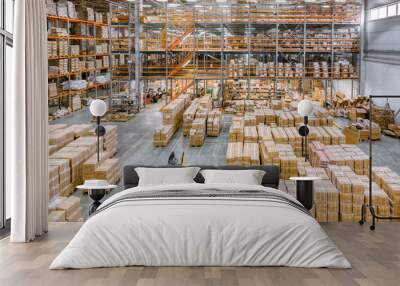 Large industrial warehouse. Many cardboard boxes stand on a loading dock Wall mural