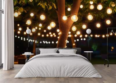 Decorative outdoor string light bulb hanging on tree in party Wall mural