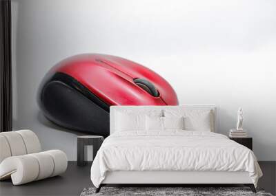 Modern red computer mouse on a white background Wall mural