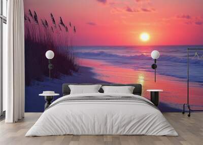 A beautiful sunrise over the ocean, with a sandy beach and tall grass in the foreground. The sky is a vibrant pink and orange, and the sun is just starting to peek over the horizon. Wall mural