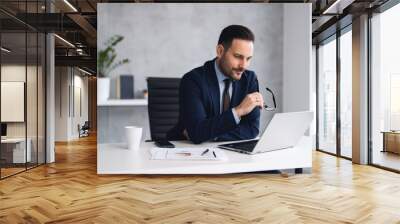 Handsome well dressed businessman working at his office, businessman working on a project Wall mural