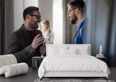 Two business men talking in office Wall mural