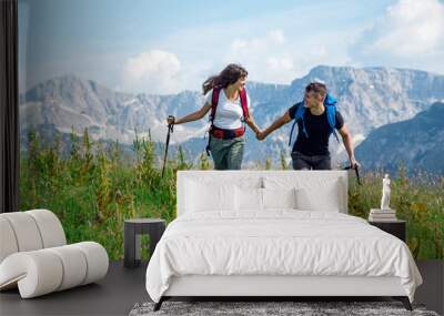 Young couple on hiking trip Wall mural