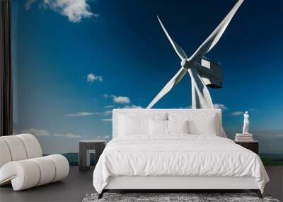 Wind generator in a sunny open field Wall mural