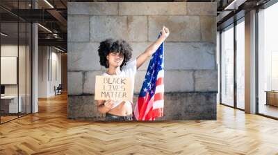 Black girl holding a US flag and a black lives matter sign Wall mural