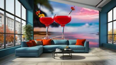 Two glasses of red cocktail with blur beach and sky on background Wall mural