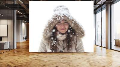 Beautiful young woman with brown hair wearing warm winter clothes smiling under falling snow Wall mural