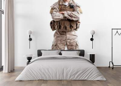 Determined young soldier stands arms crossed in military uniform on a transparent background Wall mural