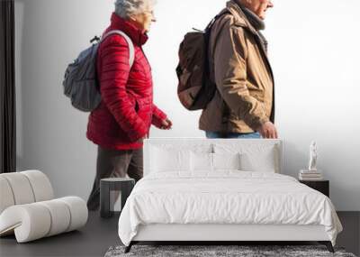 Elderly couple in warm clothing walking together, isolated on transparent background Wall mural