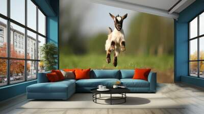 Playful jumping baby goat in green field. Funny joyful farm goat kid animal on farmland. Generate ai Wall mural