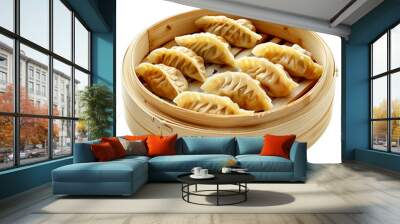 Steamed gyoza dumplings are sitting in a bamboo steamer basket Wall mural