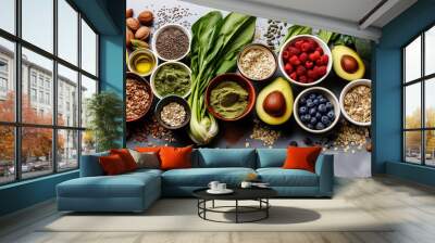 Healthy food clean eating selection: fruit, vegetable, seeds, superfood, cereal, leaf vegetable on gray concrete background Wall mural