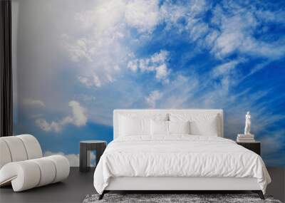 Fluffy white clouds flying on blue sky background Wall mural