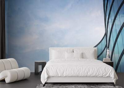 perspective of high rise building and dark steel window system with clouds reflected on the glass.bu Wall mural