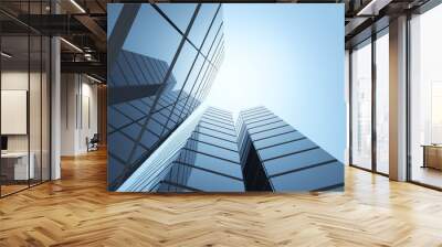 View of high rise glass office building on blue sky background,Business concept of future architecture,looking up to the sun light on the top of building. 3d rendering Wall mural