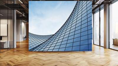 View of the clouds reflected in the curve glass office building. 3d rendering Wall mural