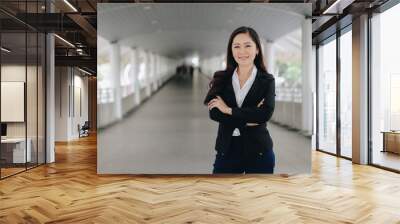 Successful asian senior businesswoman leader standing over modern pathway background Wall mural