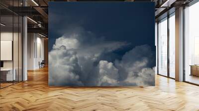 white cumulus clouds on dark blue sky before the storm Wall mural