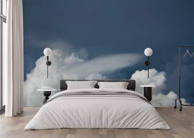 white cumulus tender clouds on dark blue sky Wall mural