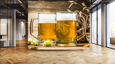 Two tankard beer closeup on wooden table Wall mural