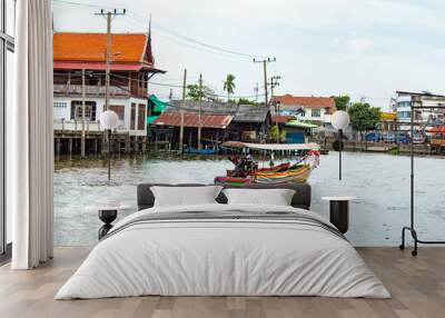 Tourist boat The driver in the evening. Wall mural