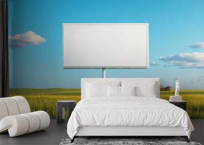 Blank billboard in a scenic rural landscape with clear blue sky. Wall mural