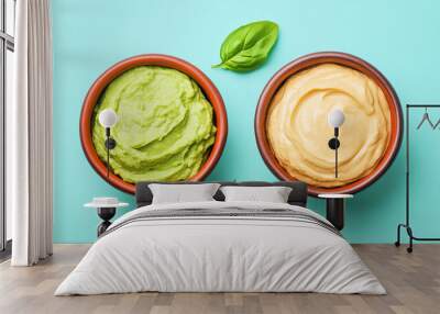 Fresh guacamole next to a bowl of creamy processed dips, illustrating healthy fats versus artificial ingredients Wall mural