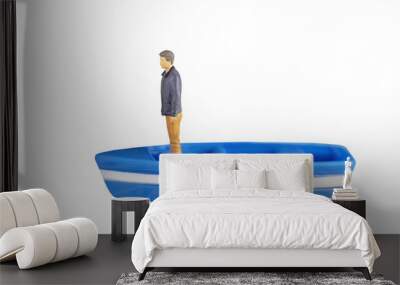 generic no brand toy of a miniature man in casual attire standing in a boat. isolated transparent png Wall mural