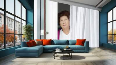 Motion blur Asian elderly woman opening home entrance door Wall mural