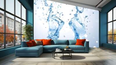 Two ice cubes splash into clear water, creating dynamic waves and bubbles against a bright background. Wall mural