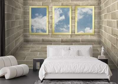 Three frames on brick wall with blue sky background Wall mural